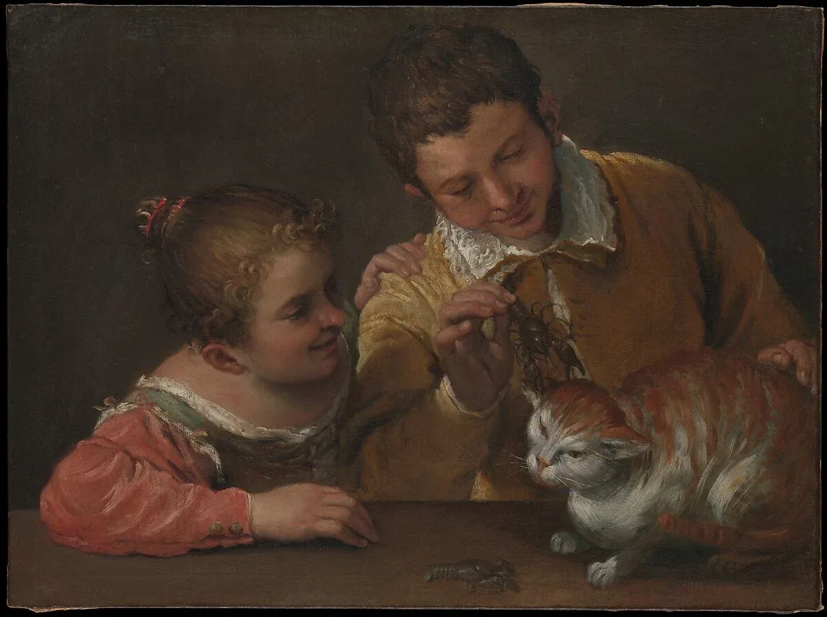 Two children lean over a table, one holding a crayfish near a cat whose tense body and open mouth suggest it is about to react.