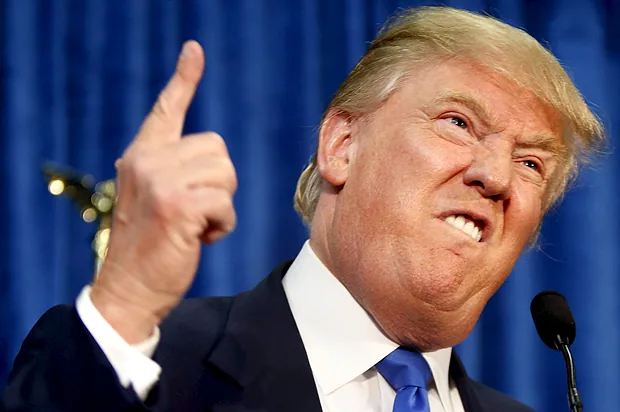 Press conference reaction meme with an emphatic expression, a raised finger, twin microphones and blue curtains.